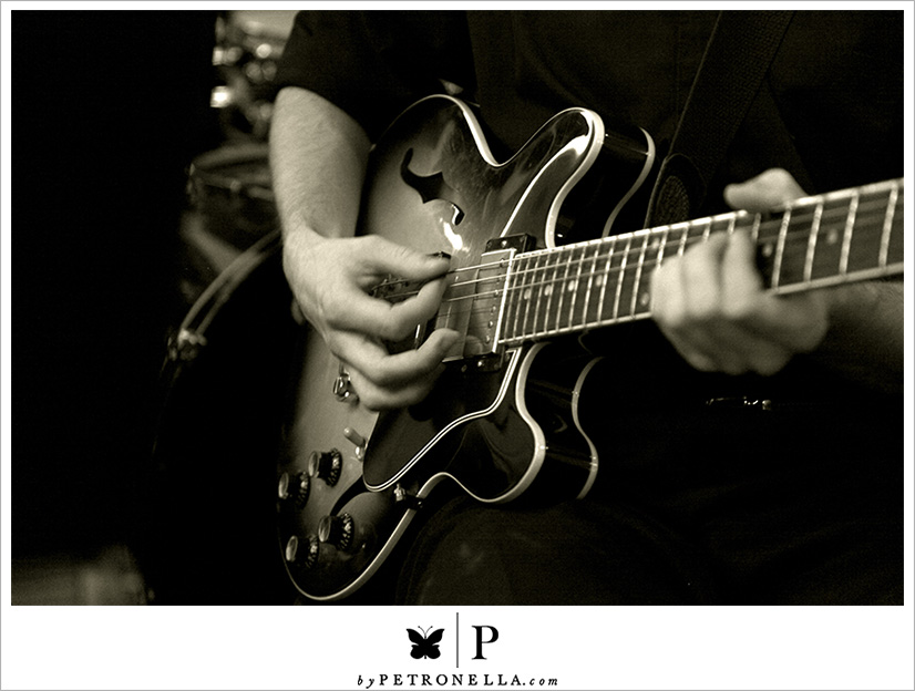 Guy strumming his guitar